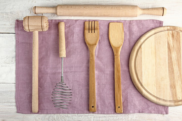 Set of wooden kitchen utensils on a napkin