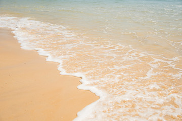 Fototapeta na wymiar sand beach with water wave.