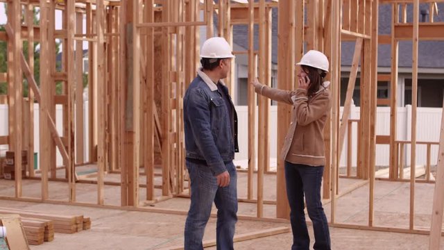 Couple seeing construction of house