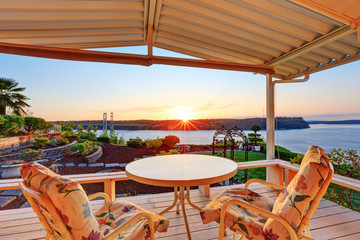 Luxury house exterior at sunset.