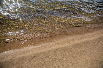 The beach with small waves.