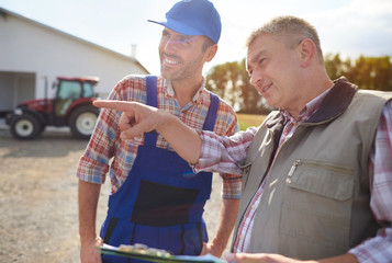 Business partners looking at the fields