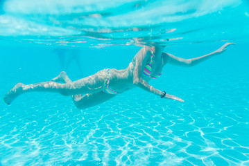 woman swimming in the pool 