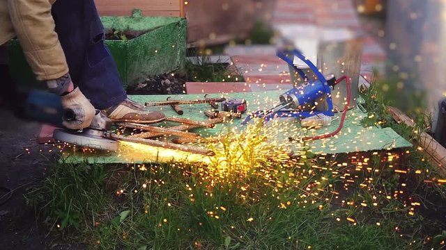 A welder working on the metals outdoor in slow motion. 1920x1080