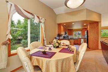 Soft beige dining room interior with nicely decorated table