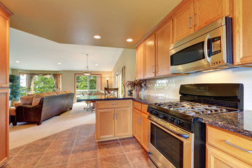 Maple kitchen cabinetry, granite counter top and tile floor