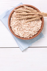 oat flakes on wooden table.healthy food concept.