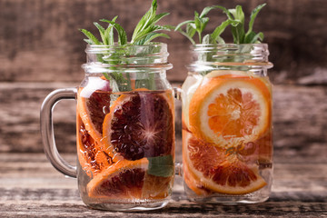 Detox citrus infused flavored water. Refreshing summer homemade cocktail
