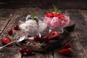 Delicious bowls of strawberry and vanilla ice cream with mint