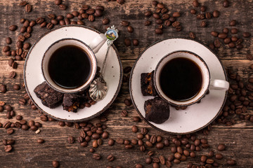 coffee cup with roasted  beans on wooden background