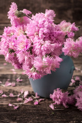 Fresh spring flowers on wooden vintage table