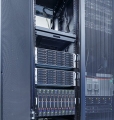 rows of server hardware with disk storage in data center