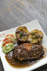 cordon bleu breaded fried chicken gravy and potatoes meal