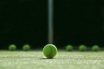 soft focus of tennis ball on tennis grass court