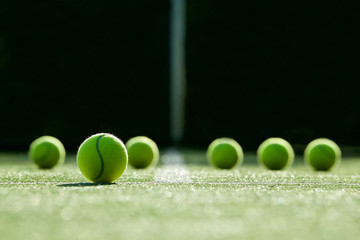 soft focus of tennis ball on tennis grass court