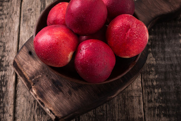 sweet fresh ripe nectarines on wooden table
