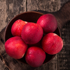 sweet fresh ripe nectarines on wooden table