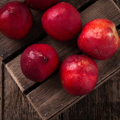 sweet fresh ripe nectarines on wooden table