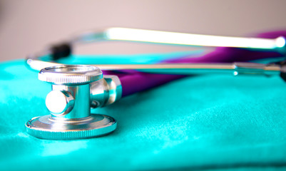 Medical stethoscope rests on a uniform close-up