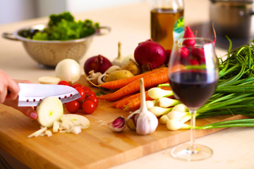 Young Woman Cooking in the kitchen. Healthy Food