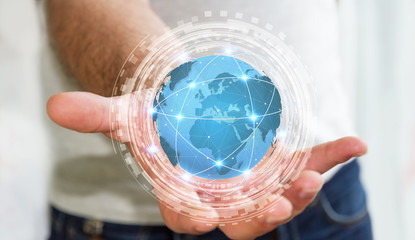 Businessman using digital tactile world interface with his hand