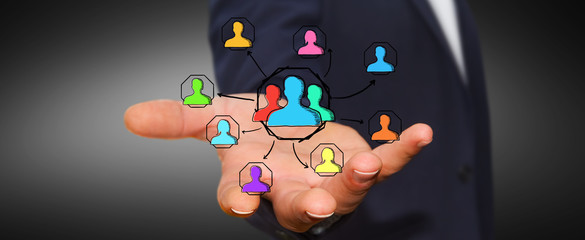 Businessman using hand drawn social network