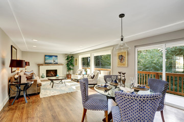 Dining area with blue chairs and table setting