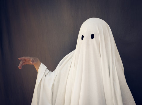 White Ghost on a gray background. Halloween holiday