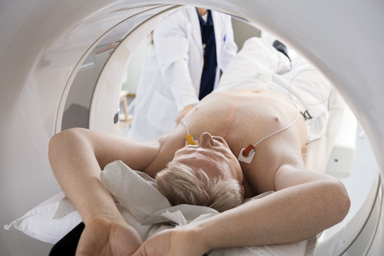 Man Going Through CT Scan In Hospital