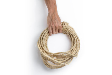 Hand holding ship rope isolated