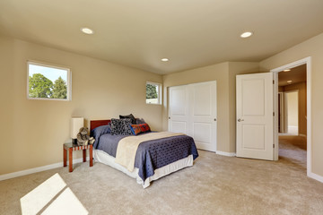 Photo of a small craftsman master bedroom with beige walls.