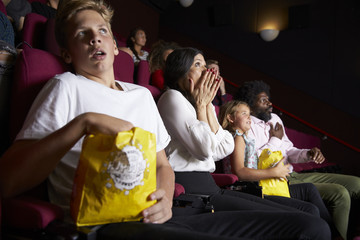 Naklejka premium Audience In Cinema Watching Horror Film