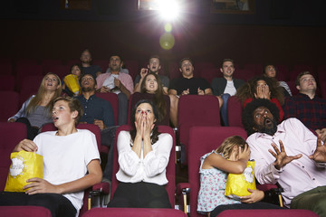 Fototapeta premium Audience In Cinema Watching Horror Film