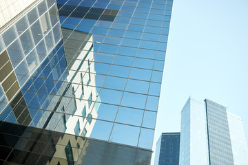Fototapeta na wymiar close up of office building or skyscraper and sky