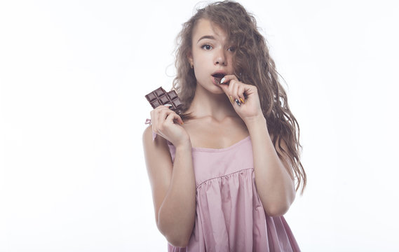 Portrait of a beautiful Woman eating chocolate.