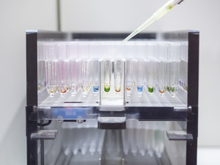 Lab with a pipette in a cuvette segments medical lab