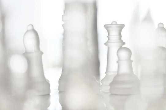Beautiful glass chess on a white background,leadership concept