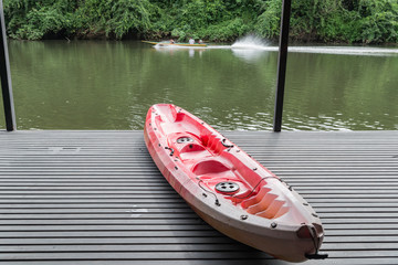 Canoe boat on raft near the river in thailand
