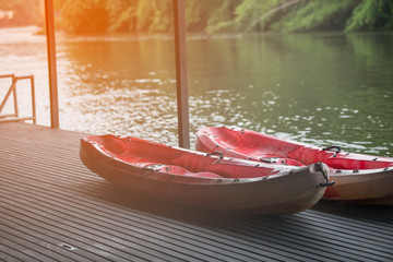 Canoe boat on raft near the river in thailand