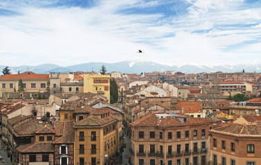Fototapeta na wymiar aerial view of old european town with snowcapped mountains