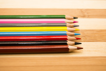 Obraz premium Colored pencils isolated on wooden background