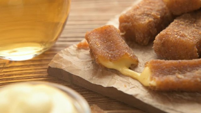 Fried cheese sticks with mayonnaise and beer