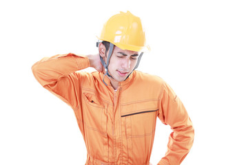 疲れた表情の労働者