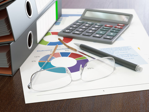 Calculator and Stack of Ring Binders