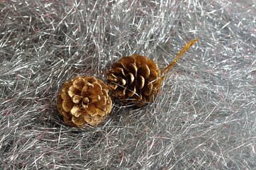 Two acorns isolated on silver tinsel