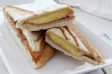 toasted cheese and tomato ham sandwich