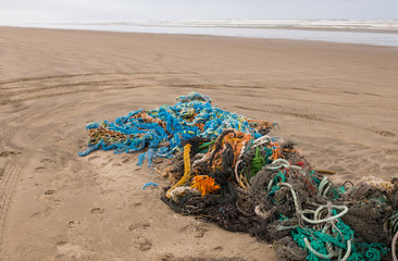 Tangled ropes and nets on ocean beach