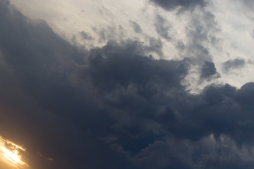 storm clouds at sunset as background
