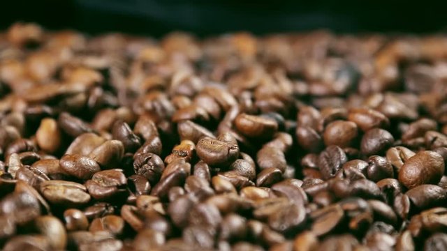 preparing roasted coffee beans with smoke