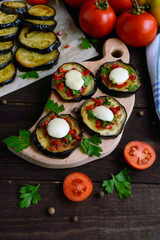 Spicy fried eggplant slices with red pepper, garlic, herbs and mozzarella.